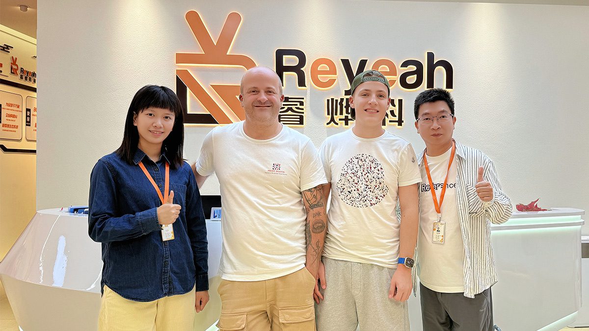 Happy international clients at Reyeah headquarters giving thumbs up for quality servic