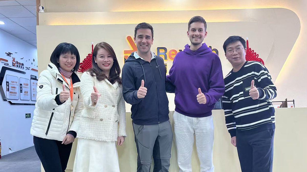 international clients at Reyeah headquarters giving thumbs up for quality servic