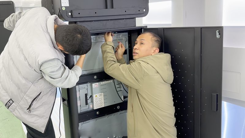 Technicians assembling smart vending machines at the Reyeah factory