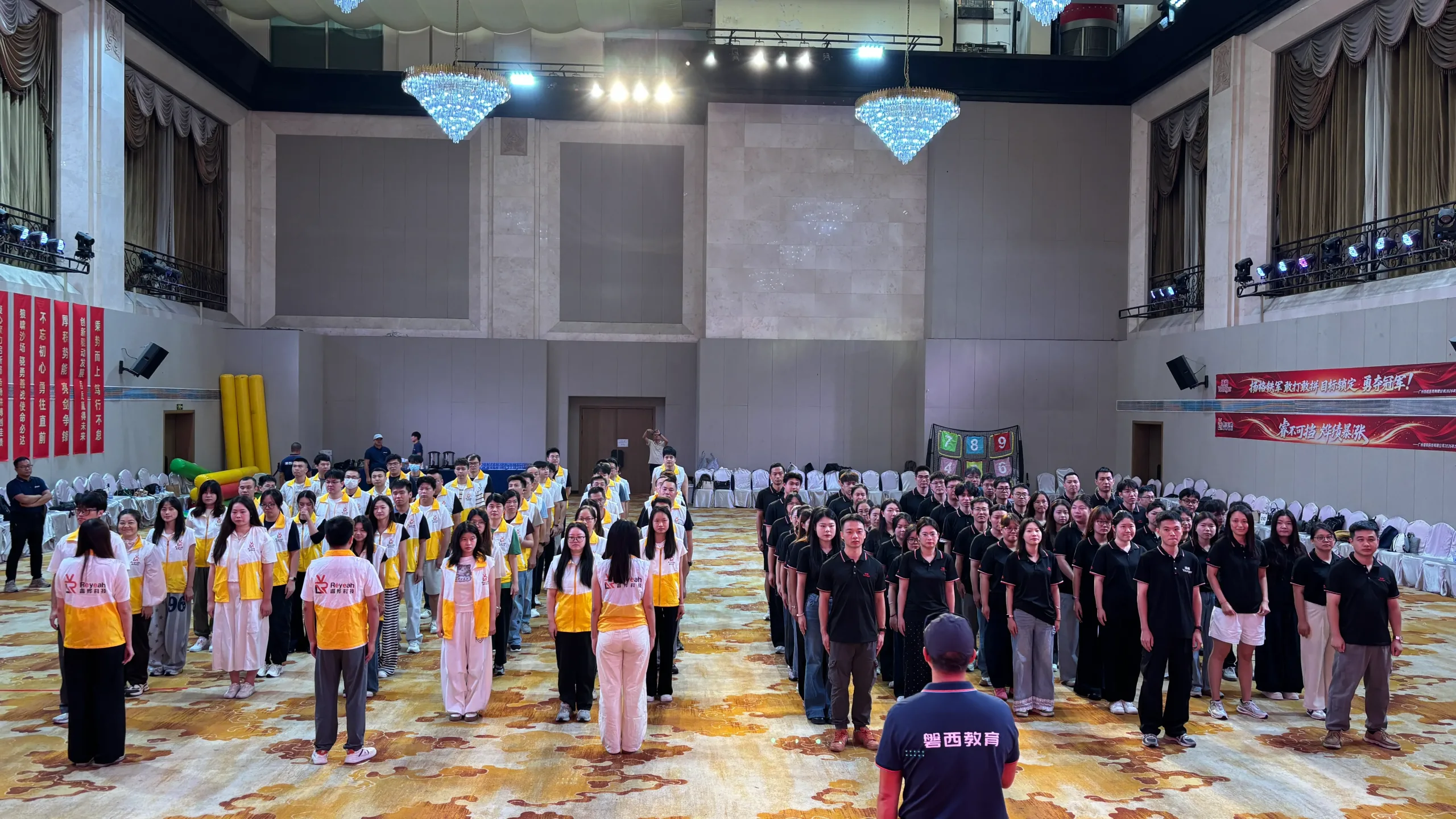 Participating teams standing in formation for the afternoon pledge at the September Sales Challenge